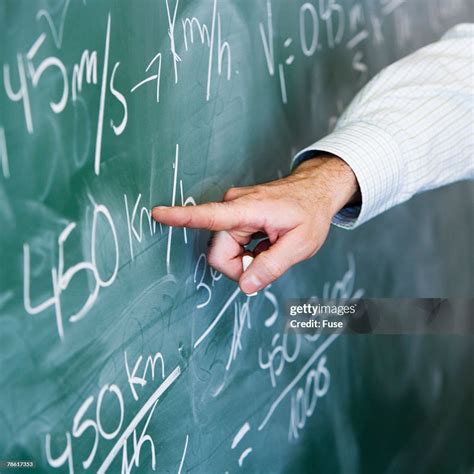 Teacher Pointing Towards Blackboard High-Res Stock Photo - Getty Images