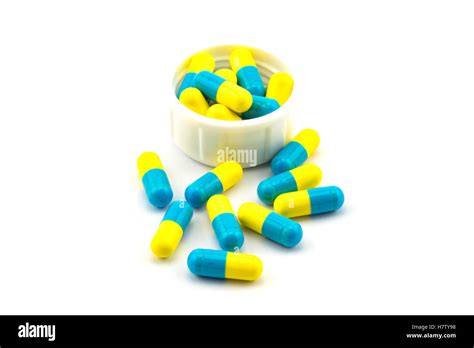 Blue and yellow antibiotic capsule on white background Stock Photo - Alamy