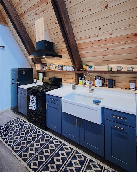 Attic Style Kitchen with Blue Cabinets and White Countertops