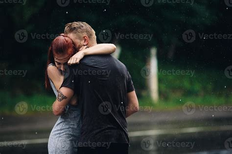 beautiful couple hugging in the rain 11445261 Stock Photo at Vecteezy