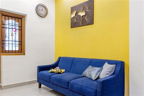 Yellow Wall Paint Design For Living Rooms | Livspace