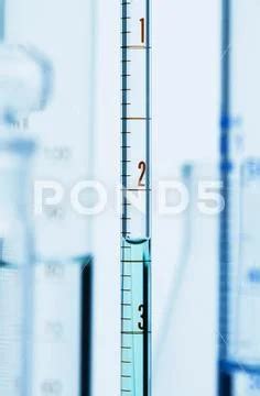 Meniscus. Curved surface (meniscus) of water in graduated pipette ...