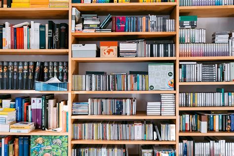 HD wallpaper: Bookshelf with books and cds, background, bookcase ...