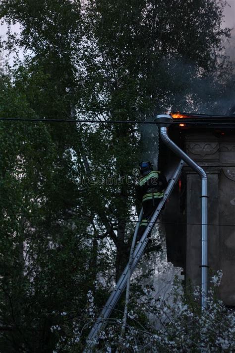 Firefighters Extinguish a Fire in an Old House Stock Photo - Image of ...