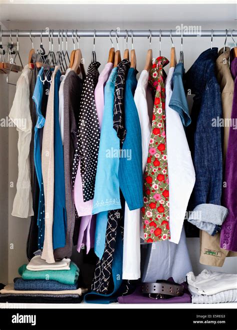 Clothes in a cupboard Stock Photo - Alamy