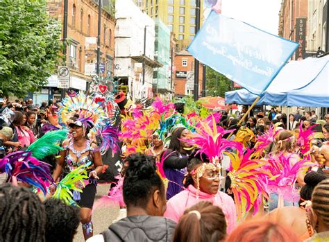 People in Colorful Costumes on the Street at a Parade · Free Stock Photo