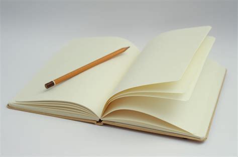 White Notebook and Yellow Pencil · Free Stock Photo