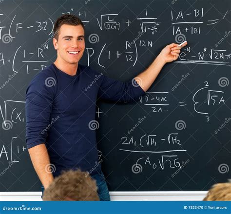 Stock Photo: Teacher pointing at blackboard teaching math. Image: 7523470