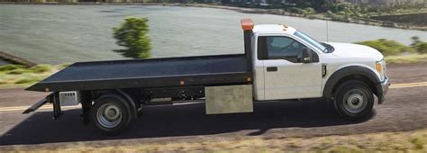 Flatbed Trucks vs. Trailers | Badger Truck & Auto Group