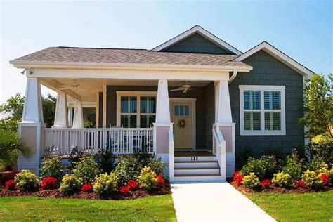 a small house with front porch and steps leading up to the front door ...