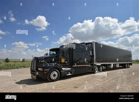 Black semi truck and trailers - resandco