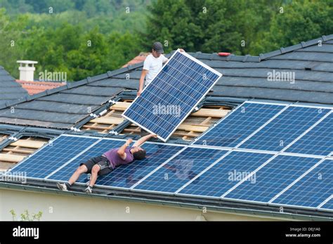 Installation of photovoltaic solar panels on roof of house, Germany ...