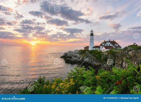 Sunrise at Portland Head Lighthouse with Flowers in the Foreground ...