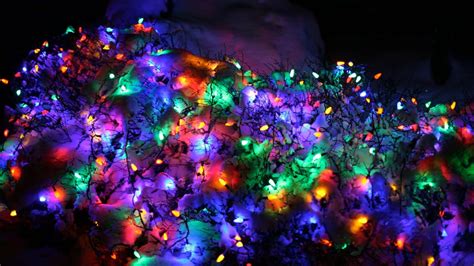 Download A Colorful Display Of Christmas Lights In The Snow ...