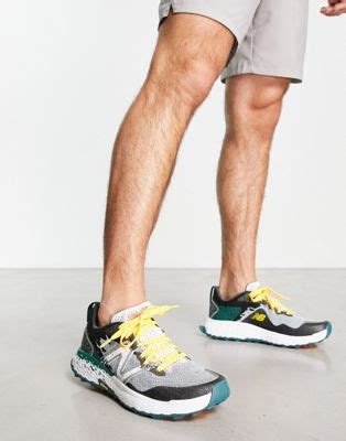 New Balance Hierro trail running trainers in grey and green | ASOS