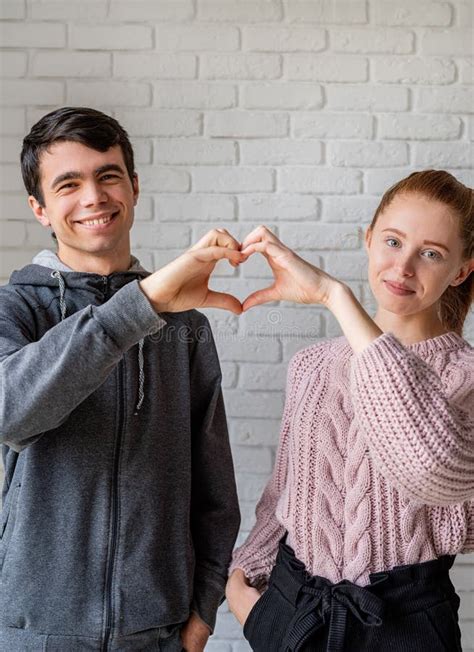 Happy Couple Making a Heart Sign with Their Hands Stock Image - Image ...