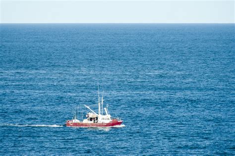 Free Image of Fishing boat sailing mid ocean | Freebie.Photography