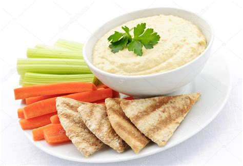 Hummus with pita bread and vegetables — Stock Photo © elenathewise #4467641