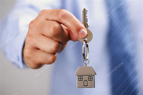 Giving house keys Stock Photo by ©BrianAJackson 31682477