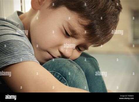 Little sad boy crying. Abuse of children concept Stock Photo - Alamy