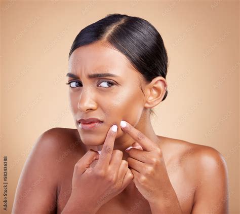 Indian woman, pimple and skincare in studio for treatment, cosmetics ...