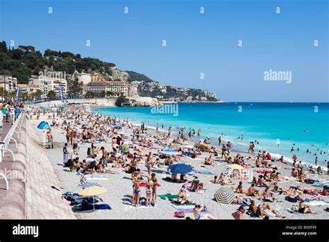 Crowded beach on the Promenade des Anglais, Nice, Cote d'Azur, French ...