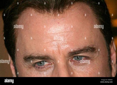 John Travolta seen with a visible mesh hairline while leaving Le ...