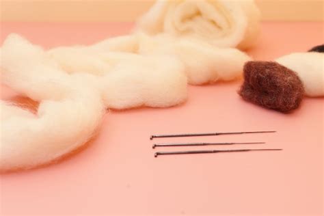 Premium Photo | Needle felting kit with white wool on pink table small ...