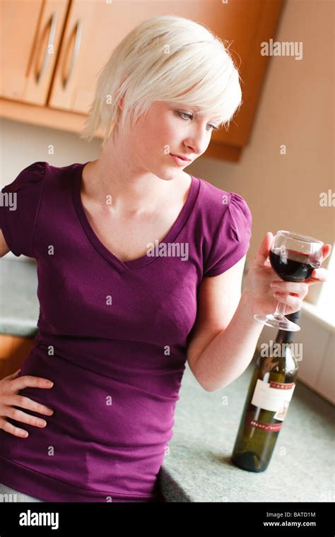 Woman drinking wine Stock Photo - Alamy