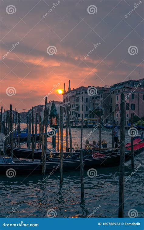 Gondola with Tourists and Gondolier at Sunset in Venice. Italian Travel ...