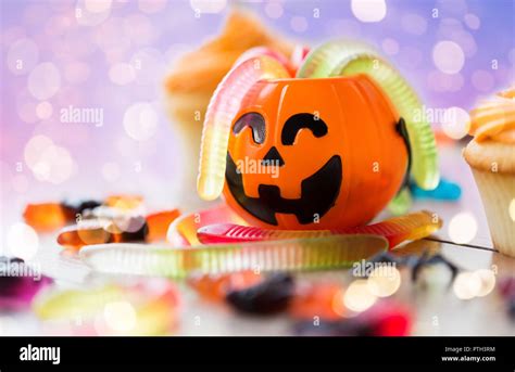 gummy worms and candies for halloween party Stock Photo - Alamy