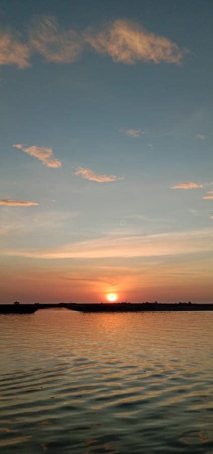 The sunset on losari beach stock photo. Image of morning - 199075376