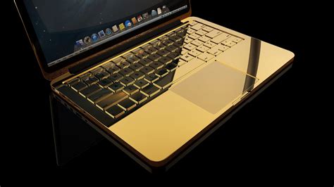 24k Gold Macbook Pro with Diamond encrusted logo | Goldgenie International