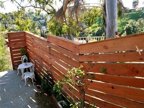 How to Build a Horizontal Plank Fence in a Hillside Backyard | HGTV