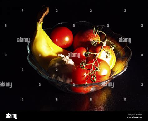 Glass bowl with fruits Stock Photo - Alamy