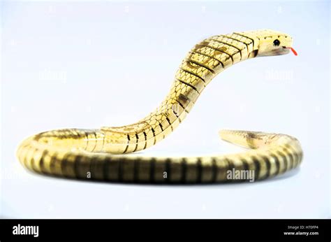 King cobra snake toy made from wooden Stock Photo - Alamy