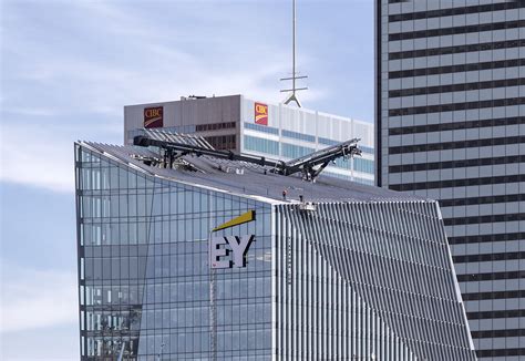 20190926. Working on the slanted skyscraper roof of the EY Tower ...