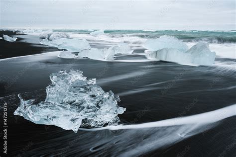 Ice on the beach with black sand in Iceland Stock Photo | Adobe Stock