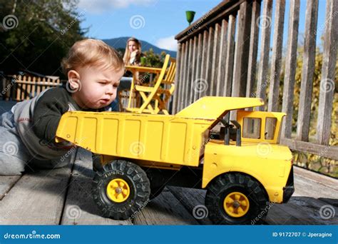 Baby Boy Playing With Truck Royalty-Free Stock Photo | CartoonDealer ...