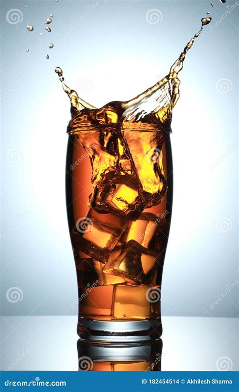 Cold Drink Splash with Ice Cubes Stock Photo - Image of fast, splashing ...