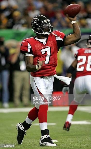 Quarterback Michael Vick of the Atlanta Falcons delivers a pass ...