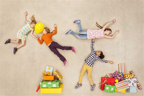 Children with heaps of birthday presents stock photo