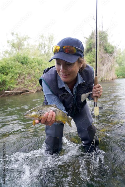 woman fishing in the river Stock Photo | Adobe Stock