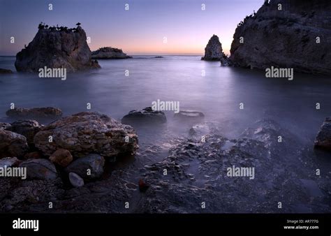 Shell beach sunset Stock Photo - Alamy