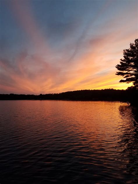 Sunset on a lake, on Sunset Lake : r/CampingandHiking