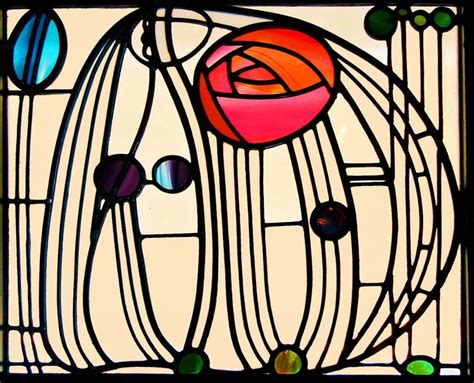 a stained glass window with a rose on it's face and some circles around it