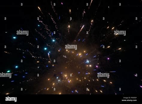 exploding fireworks in night sky Stock Photo - Alamy