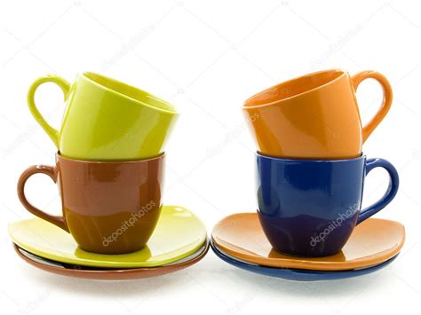 Four Cups with Saucers of Different Colours — Stock Photo © Avumir #4978872