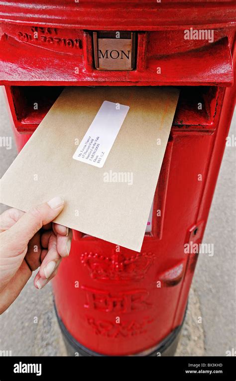 Posting a Letter Into a Post Box, UK Stock Photo: 33272665 - Alamy