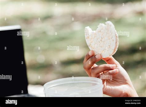 A hand grabbing a healthy food in the park Stock Photo - Alamy